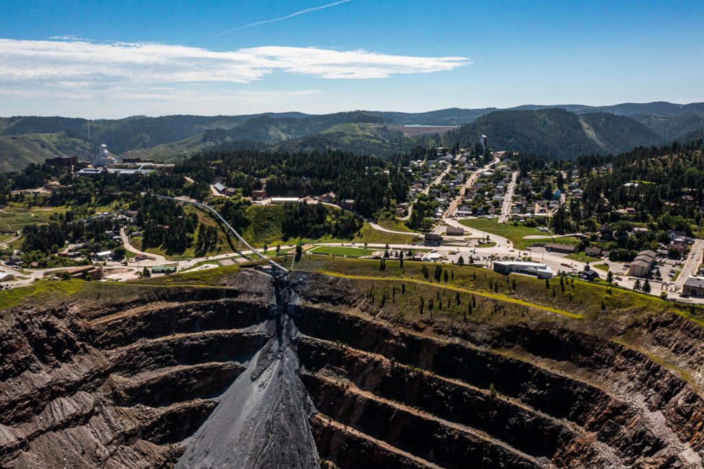 A long conveyor carried almost 800,000 tons of rock excavated a mile underground into the Open Cut in Lead, South Dakota. Credit: Stephen Kenny, Sanford Underground Research Facility